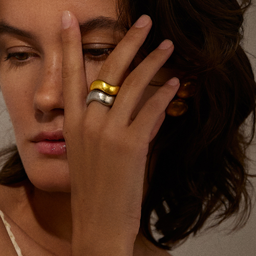 belperron-Wide-Wave-Ring-Virgin-Gold and gray gold stacked on model